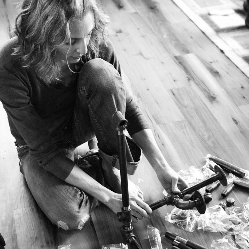 Stephanie Ray puts together back pipe for DIY desk