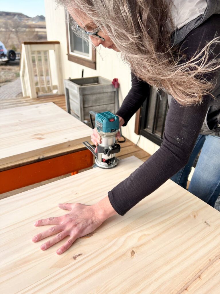 Stephanie Ray Routering Edges of Desk top